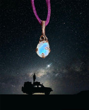 Mini Rainbow Moonstone Pendant in a Prong Setting