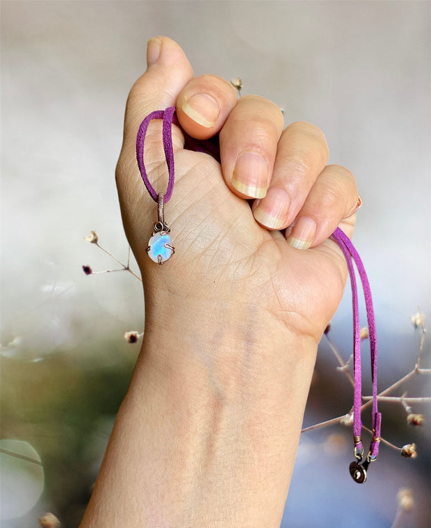 Mini Rainbow Moonstone Pendant in a Prong Setting