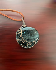 Arfvedsonite Wire Wrapped Pendant Crescent Moon - Connie’s Crystals 